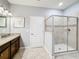 Bathroom with a walk-in shower and double vanity at 9158 Wedge Dr, Davenport, FL 33896