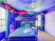 Jungle-themed bedroom with a bunk bed and mural at 9158 Wedge Dr, Davenport, FL 33896