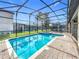 Screened pool and spa with brick patio at 9158 Wedge Dr, Davenport, FL 33896