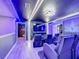 Home theater room with themed walls and multiple theater seats at 9158 Wedge Dr, Davenport, FL 33896