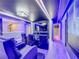 State-of-the-art home theater with vibrant lighting and comfortable seating at 9158 Wedge Dr, Davenport, FL 33896