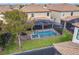 Aerial view of a screened pool and spa at 9158 Wedge Dr, Davenport, FL 33896