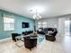 Relaxing living room with sectional sofa, large TV, and accent chairs at 9158 Wedge Dr, Davenport, FL 33896