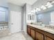 Double vanity bathroom with granite countertops at 9158 Wedge Dr, Davenport, FL 33896