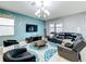 Living room features sectional sofa, large TV, and stylish decor at 9158 Wedge Dr, Davenport, FL 33896