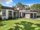 Modern house with gray stone and a green lawn at 98 E 10Th Ave, Windermere, FL 34786