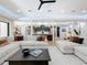Open living space with sectional sofa and view of kitchen at 98 E 10Th Ave, Windermere, FL 34786