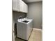 Bright laundry room, featuring Samsung washer and dryer, and ample storage at 1021 Hacienda Cir, Kissimmee, FL 34741