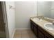 Bathroom with double vanity and dark wood cabinets at 1021 Hacienda Cir, Kissimmee, FL 34741