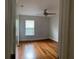 Well-lit bedroom featuring hardwood floors at 1021 Hacienda Cir, Kissimmee, FL 34741