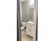 Small bathroom with a white vanity and neutral color scheme at 1021 Hacienda Cir, Kissimmee, FL 34741