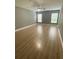 Large living room featuring wood-look flooring and neutral walls at 1021 Hacienda Cir, Kissimmee, FL 34741