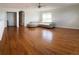 Spacious living room with hardwood floors and a sectional sofa at 1021 Hacienda Cir, Kissimmee, FL 34741