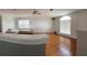 Open living area with hardwood floors and large windows at 1021 Hacienda Cir, Kissimmee, FL 34741