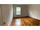 Bright bedroom with hardwood floors and a large window at 1021 Hacienda Cir, Kissimmee, FL 34741