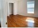 Bright bedroom with hardwood floors and a double door closet at 1021 Hacienda Cir, Kissimmee, FL 34741