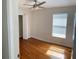 Bedroom with hardwood floors, closet, and window at 1021 Hacienda Cir, Kissimmee, FL 34741