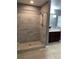 Bathroom with walk-in shower, tile flooring, and neutral color palette at 1021 Hacienda Cir, Kissimmee, FL 34741