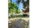 Landscaped backyard with lush greenery and a wall at 10849 Wyandotte Dr, Clermont, FL 34711