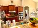 Modern kitchen boasts ample cabinetry and granite countertops at 10849 Wyandotte Dr, Clermont, FL 34711