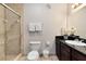 Bathroom with shower, vanity with granite top, and toilet at 1301 Tuscan Ter # 9106, Davenport, FL 33896