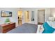 Bedroom with queen bed, dresser, and walk-in closet at 1301 Tuscan Ter # 9106, Davenport, FL 33896