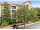 Residential building with balconies, landscaping, and parking at 1301 Tuscan Ter # 9106, Davenport, FL 33896