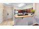 Open kitchen with granite countertops and stainless steel appliances at 1301 Tuscan Ter # 9106, Davenport, FL 33896