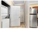 Stackable washer and dryer in small laundry room at 1301 Tuscan Ter # 9106, Davenport, FL 33896
