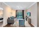 Comfortable living room featuring a grey sofa and sliding glass doors at 1301 Tuscan Ter # 9106, Davenport, FL 33896