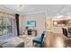 Open living room with hardwood floors and access to the kitchen at 1301 Tuscan Ter # 9106, Davenport, FL 33896