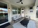 Covered patio with seating area and a view of the pool at 1799 Caribbean View Ter, Kissimmee, FL 34747