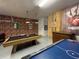 Game room with pool table and air hockey at 1799 Caribbean View Ter, Kissimmee, FL 34747