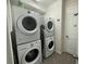 Laundry room with two sets of washer and dryer at 1799 Caribbean View Ter, Kissimmee, FL 34747