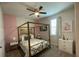 Bedroom with Parisian themed decor and a canopy bed at 1799 Caribbean View Ter, Kissimmee, FL 34747