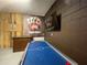 Fun game room with air hockey, foosball, and pool table at 1799 Caribbean View Ter, Kissimmee, FL 34747
