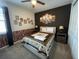 Bedroom with a western theme, featuring a comfy bed and wall art at 1799 Caribbean View Ter, Kissimmee, FL 34747