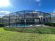 Screened pool and spa area in backyard at 1799 Caribbean View Ter, Kissimmee, FL 34747
