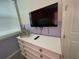 ' bedroom with a dresser and mounted TV at 1799 Caribbean View Ter, Kissimmee, FL 34747