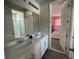 Bathroom with a double vanity, and view of another bedroom at 1799 Caribbean View Ter, Kissimmee, FL 34747