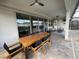 Outdoor patio with seating area and dining table at 1799 Caribbean View Ter, Kissimmee, FL 34747