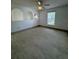 Bright living room featuring tile floors and a ceiling fan at 1802 Emily Dr, Winter Haven, FL 33884