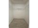 Large walk-in closet with wire shelving at 1802 Emily Dr, Winter Haven, FL 33884