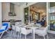 Outdoor kitchen with grill and dining table at 2133 Pine Oak Loop, Davenport, FL 33837