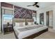 Guest bedroom with twin beds and geometric accent wall at 2133 Pine Oak Loop, Davenport, FL 33837