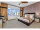 Spacious main bedroom with large windows and elegant furnishings at 2133 Pine Oak Loop, Davenport, FL 33837