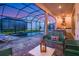 Patio with pool view, seating, and grill at 2133 Pine Oak Loop, Davenport, FL 33837