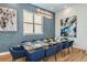 Elegant dining room with a large table and blue chairs at 2133 Pine Oak Loop, Davenport, FL 33837