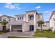 Modern two-story house with gray exterior at 2133 Pine Oak Loop, Davenport, FL 33837
