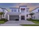 Two-story house with a gray garage door at 2133 Pine Oak Loop, Davenport, FL 33837